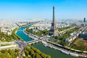 Iconic Eiffel Tower in Paris with Seine River and cityscape views.