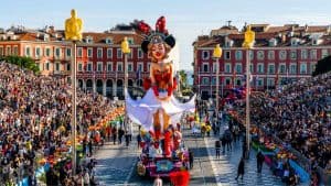 Nice Carnival in Nice 2026 - Festive Parade and Decorations 3 Colorful carnival float with giant puppet during Nice Carnival 2026 parade.
